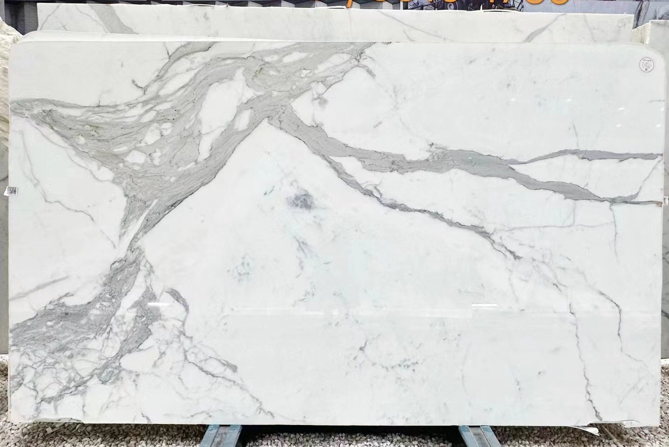 Calacatta Carrara marble: pure white background with sophisticated grey veining — authentic Apuan origin